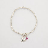 Silver heart beaded bracelet featuring a genuine ruby stone