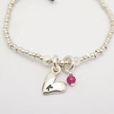 Silver initial-stamped heart fine silver beaded bracelet