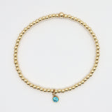 Gold-filled stretch bracelet with sapphire-colored cubic zirconia