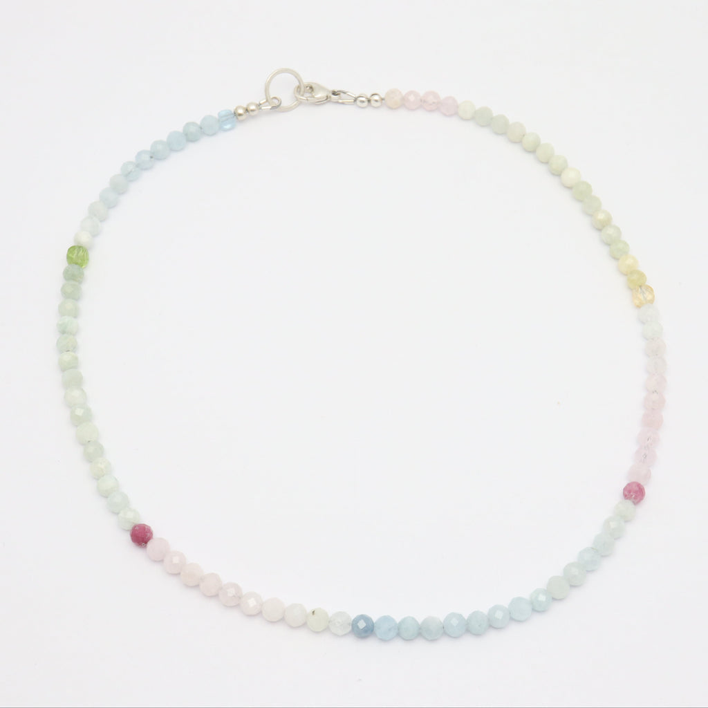 Necklace with multicolored beads on a white background