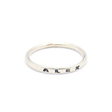 Silver ring with 'ALEX' engraved on a white background