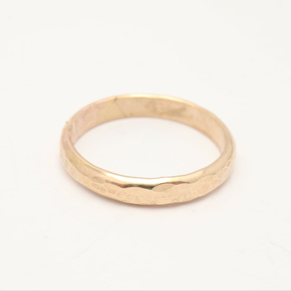 Gold ring on a white background