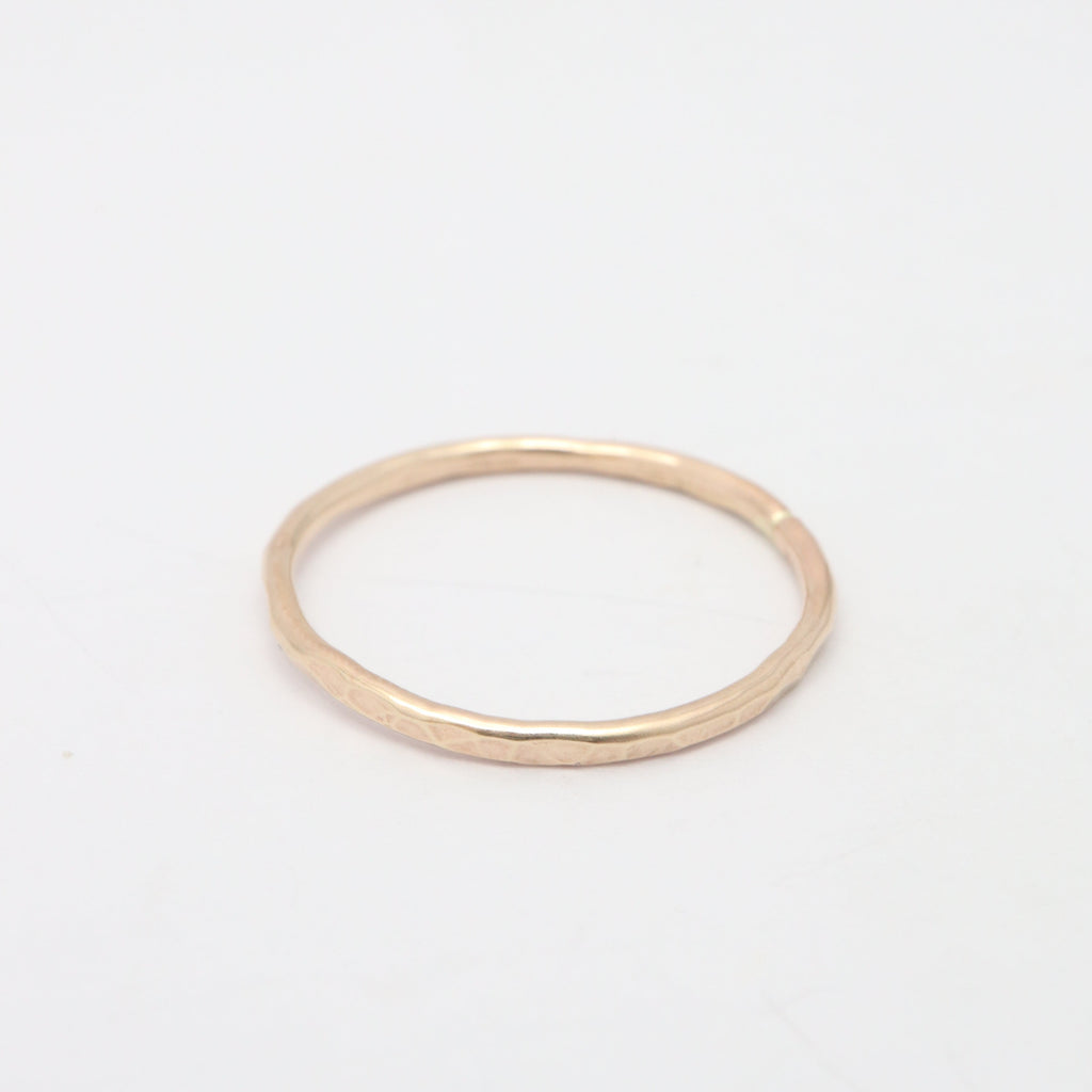 Gold ring on a white background