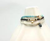 ARCTIC BLOSSOMS:  Ochre & Jet Black/Blue Briolette Bracelet