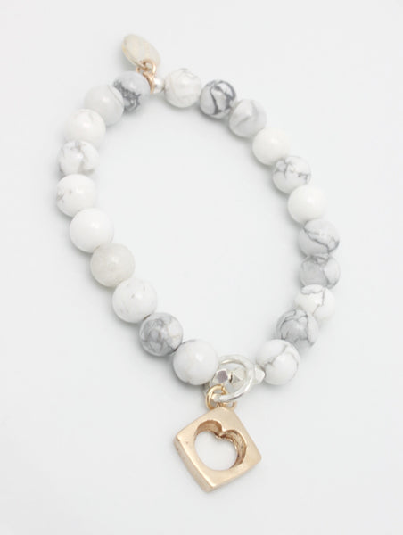 White Howlite Stone Stretch Bracelet with Bronze Cutout Heart Pendant
